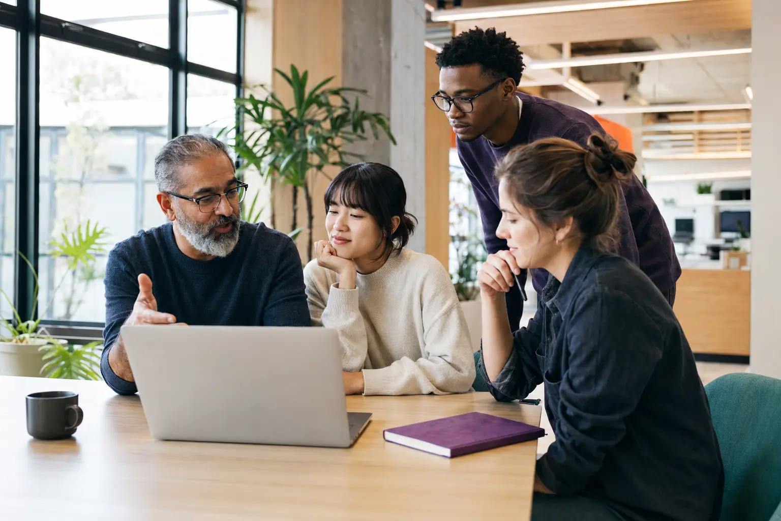 Technology professionals learning and collaborating in a modern workspace